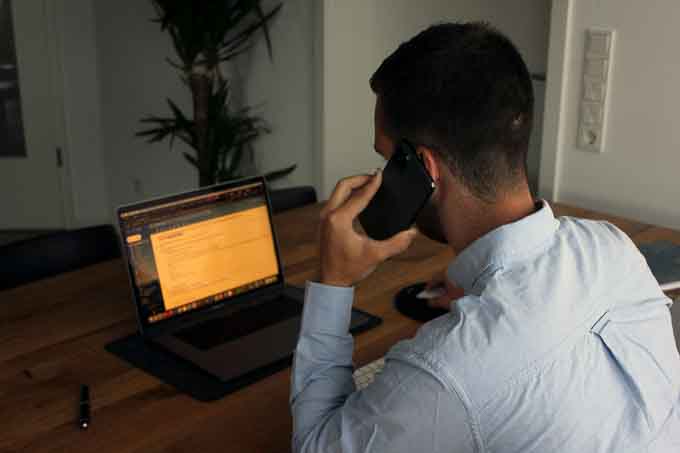 Man on phone with client